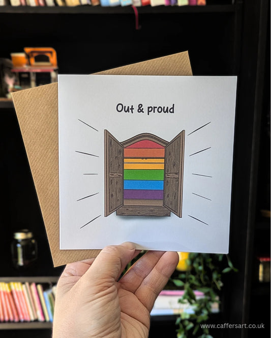 Greeting card with rainbow stripes inside an open closet and the words "Out & Proud" perfect for LGBTQ+ coming out, Pride celebrations or supporting the queer community