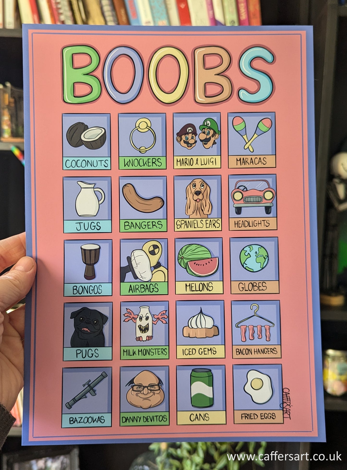 Cartoon style art print with colorful illustrations and text on a pink background, with boobs written at the top. The 20 illustrations represent slang words for boobs including Mario & Luigi, bongos, pugs, and fried eggs